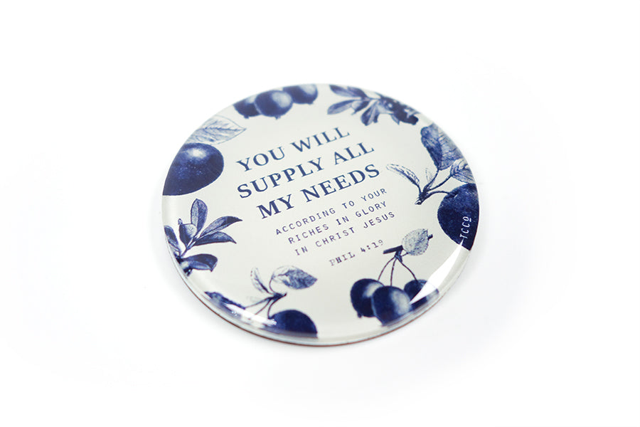 Close up of 5.5 cm diameter circular Acrylic fridge magnet with bible verse “You will supply all my needs” on blue fruits background.