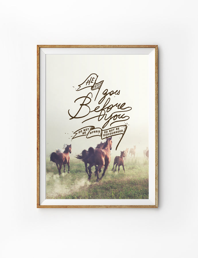 Poster featuring typography bible verses with running horse designs ‘He goes before you, do not be afraid, do not be discouraged’ is hung on the wall in a gold photo frame. 200GSM paper, available in A3,A4 size.