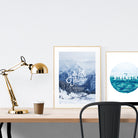 A3 beautiful calligraphy poster placed standing next to a smaller A4 sized calligraphy poster on a wooden table. Modern home interior design ideas.