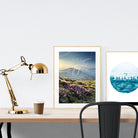 A3 beautiful calligraphy poster placed standing next to a smaller A4 sized calligraphy poster on a wooden table. Modern home interior design ideas.