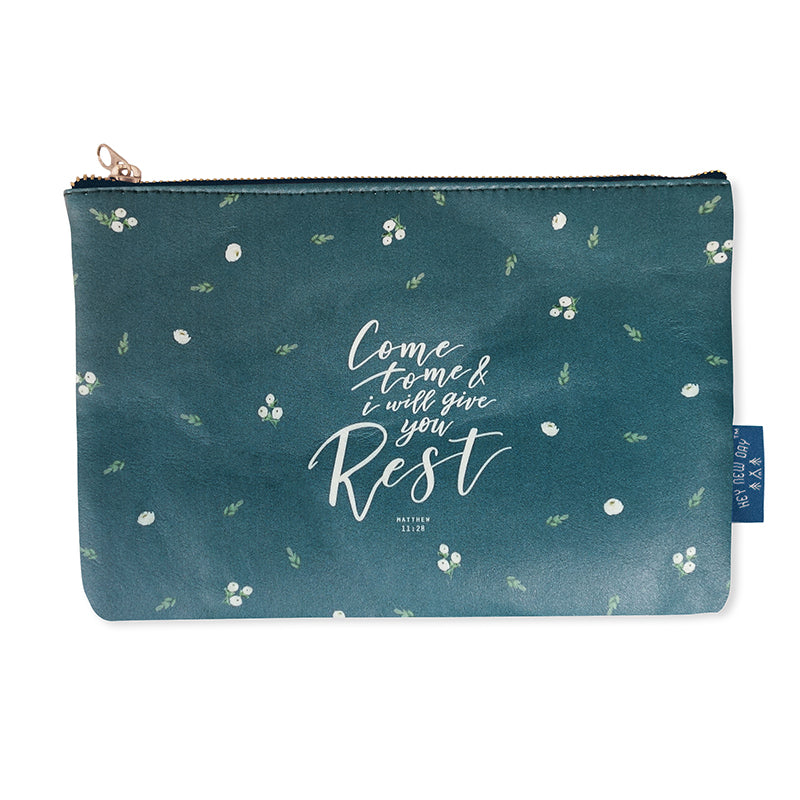 Multipurpose PU Leather pouch in green with lily of the valley designs on it. Features bible verse ‘Come to me and I will give you rest ' in white lettering and is great Christian gift idea. The pouch has inner lining, gold zip. Dimensions: 21cm (W) x 14cm (H)