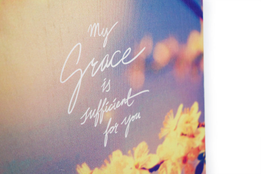 Close up of motivational bible verse ‘My grace is sufficient for you’ on sakura background digitally printed on 16cmx20cm quality pine wood.
