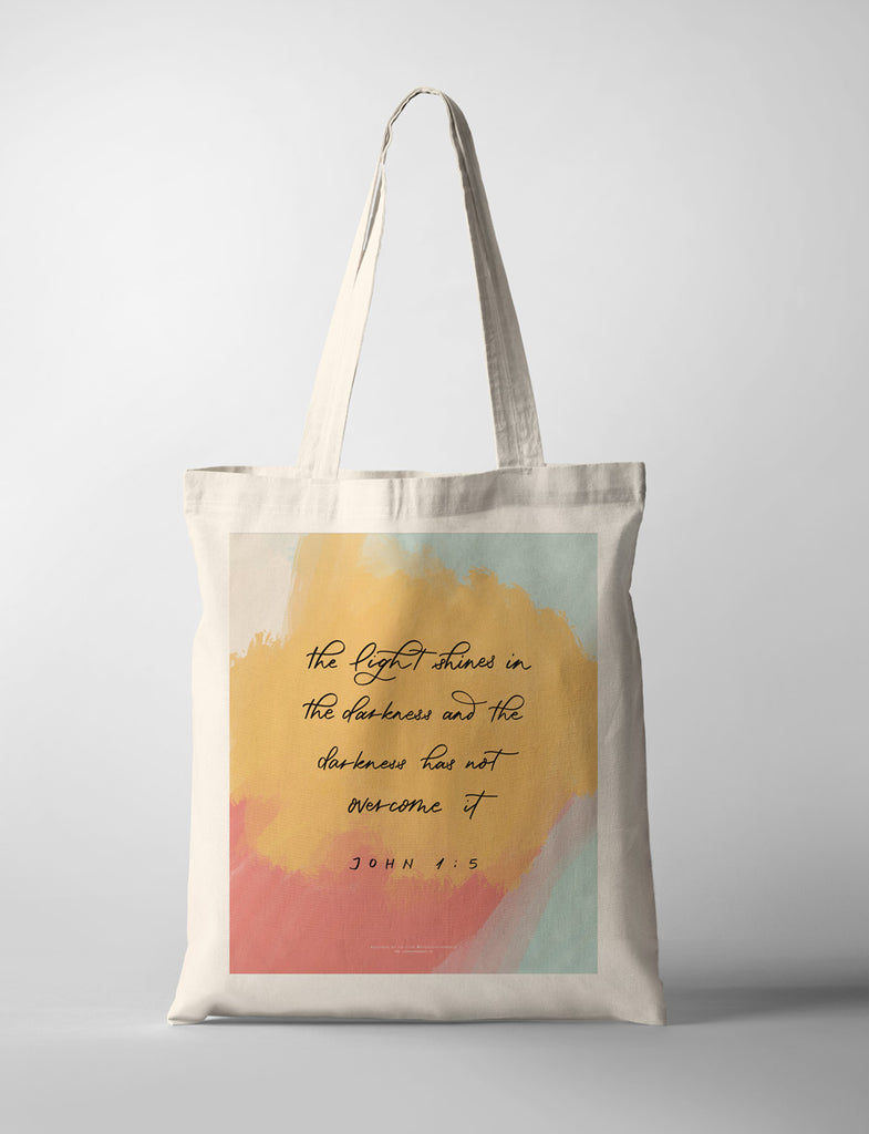 the light shines in the darkness encouraging wordings tote bag outfit design