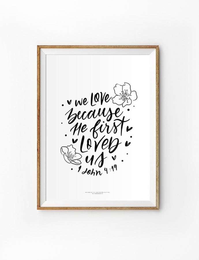 Christian wall art poster that says "We love because he first loved us" designed by @giusletters